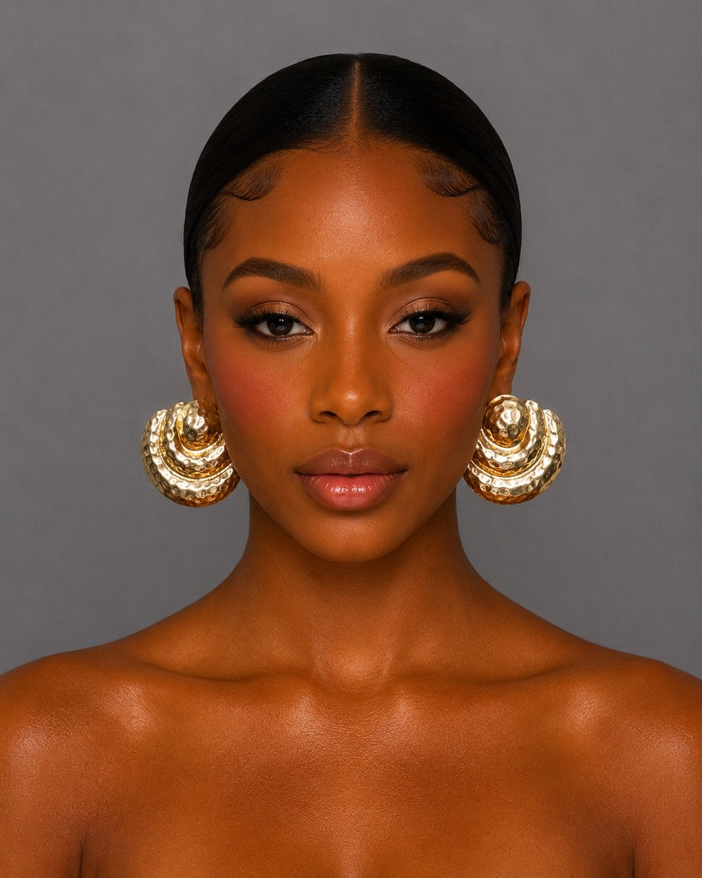 Gold pleated metal earrings