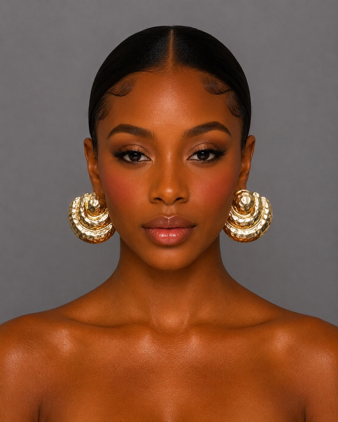 Gold pleated metal earrings